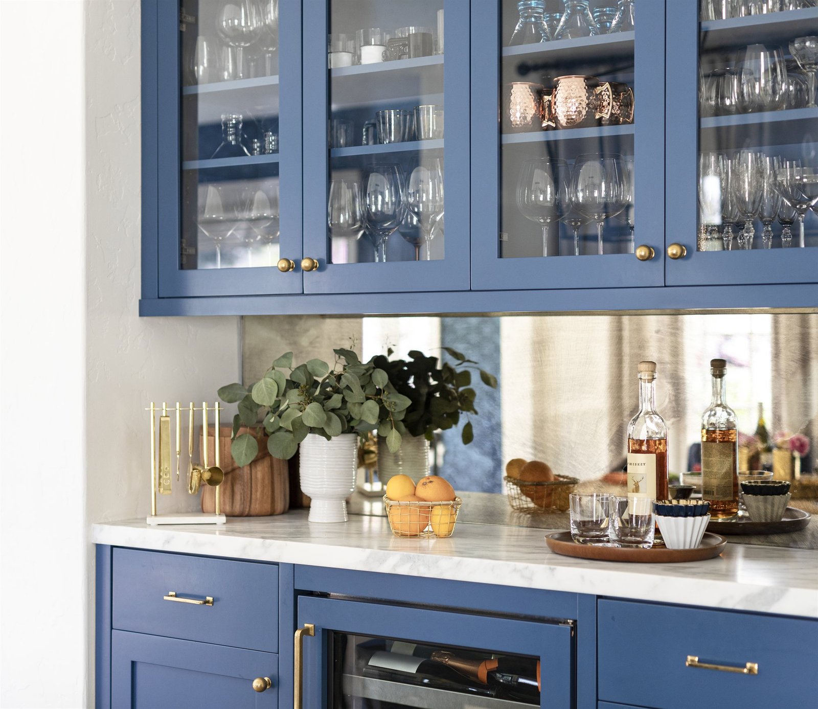 Custom architectural wine bar cabinet with glassware and bespoke millwork